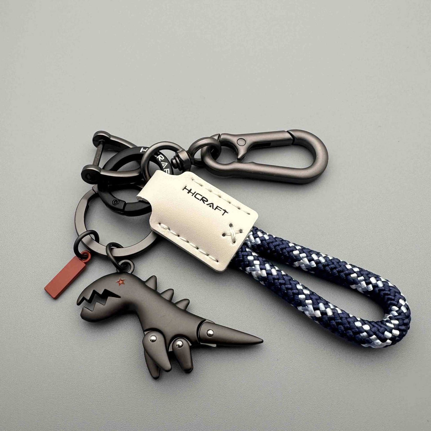 Dinosaurier-Anhänger aus Aluminiumlegierung, kombiniert mit einem handgeflochtenen Armband